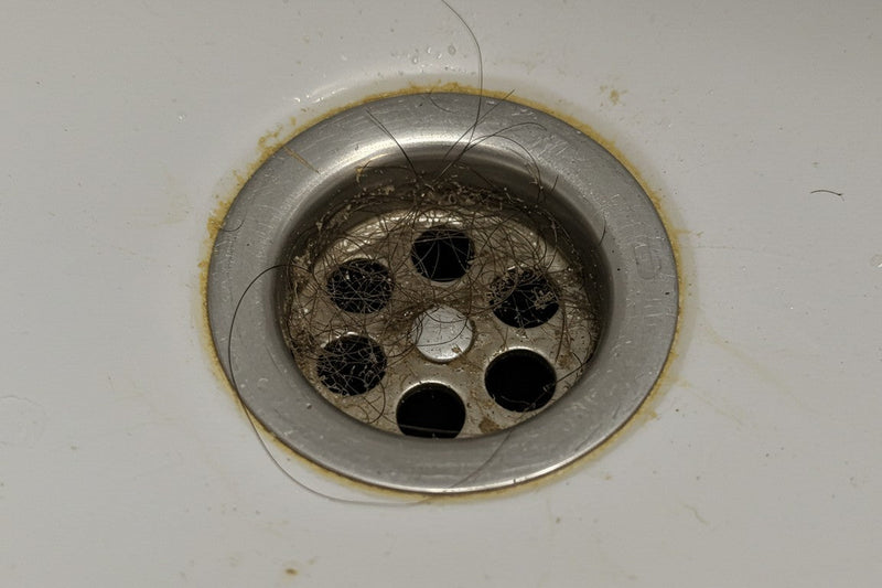 How to clean hair and soap scum from drains